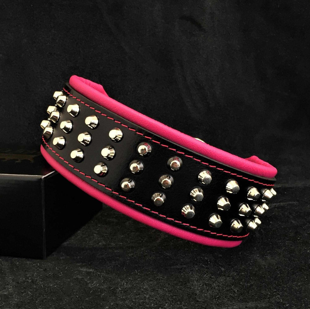 Stud collar in black genuine leather with three rows of shiny silver barrel studs and bright pink soft padding edges.
