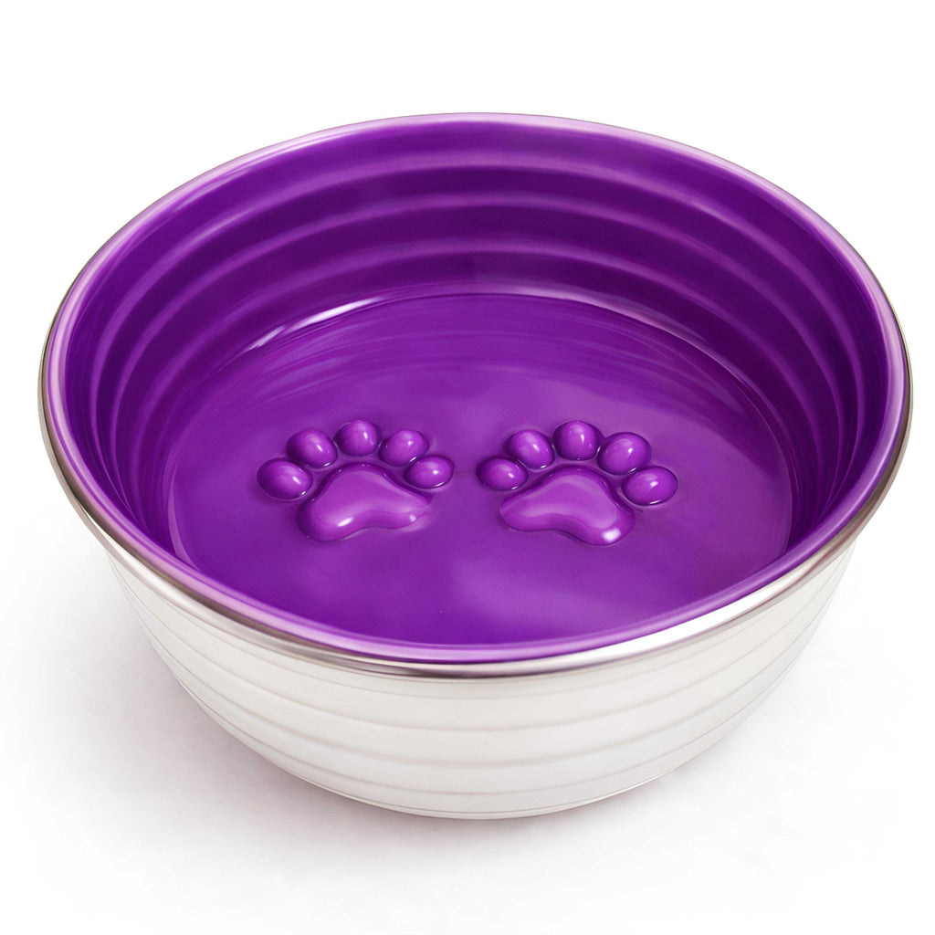 The Poppy Collection Dog Bowl with a violet hand-finished interior, stainless steel exterior, and raised paw prints inside.