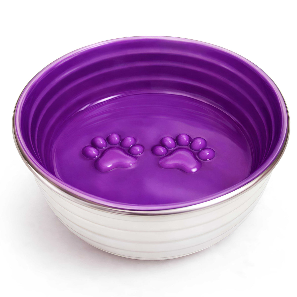 The Poppy Collection Dog Bowl with a violet hand-finished interior, stainless steel exterior, and raised paw prints inside.