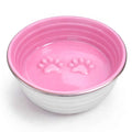 The Poppy Collection Dog Bowl in pink with stainless steel exterior, glossy interior, and raised paw print design inside.