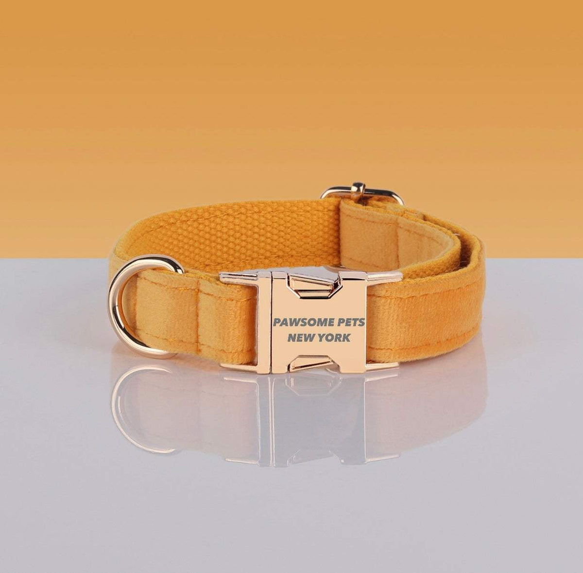 PAWSOME DOG COLLAR in yellow nylon with metal buckle engraved "PAWSOME PETS NEW YORK," adjustable design.