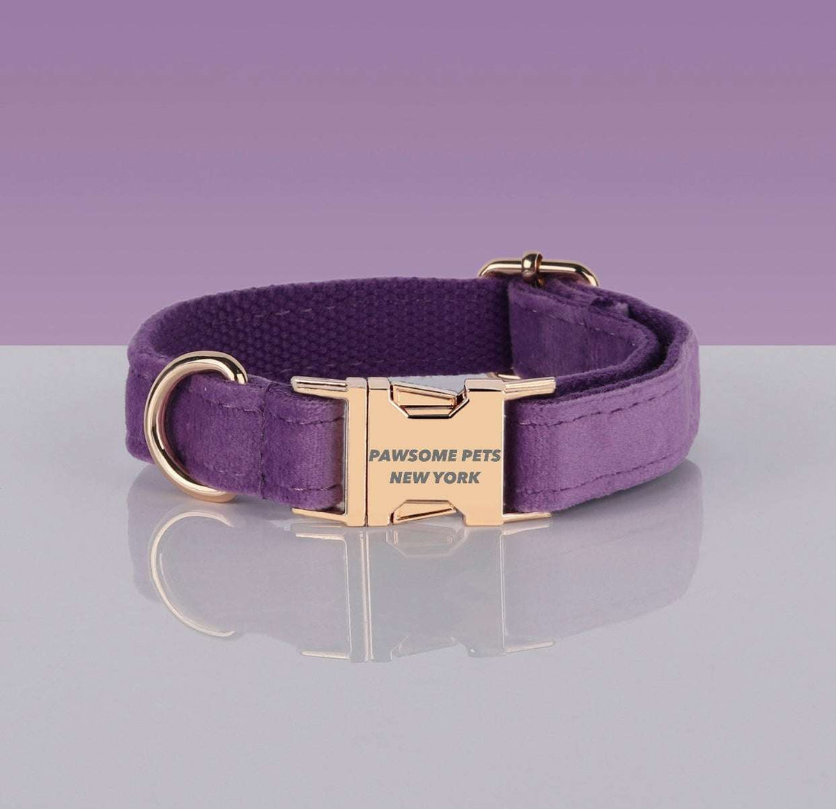Purple nylon Pawsome Dogs Collar with gold metal buckle and adjustable strap featuring "PAWSOME PETS NEW YORK" engraving.