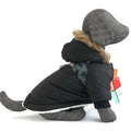 Small dog winter pet clothes in black waterproof windbreaker fabric with thick fluffy lining and fur-trimmed hood for warmth and comfort.