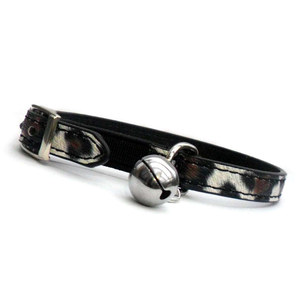 Leopard Print Cat Collar with black safety elastic, adjustable buckle holes, and silver bell with D-ring attachment.
