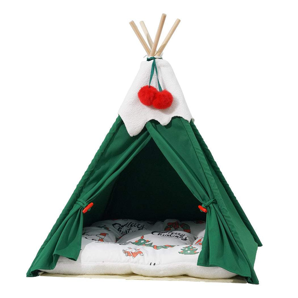 Pawz Pet Tent green polyester teepee with solid pine wood poles, white top detail, and a removable cushioned floor with winter-themed print.