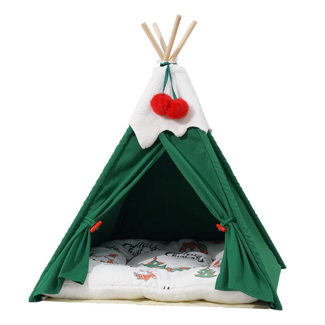 Pawz Pet Tent green polyester teepee with solid pine wood poles, white top detail, and a removable cushioned floor with winter-themed print.