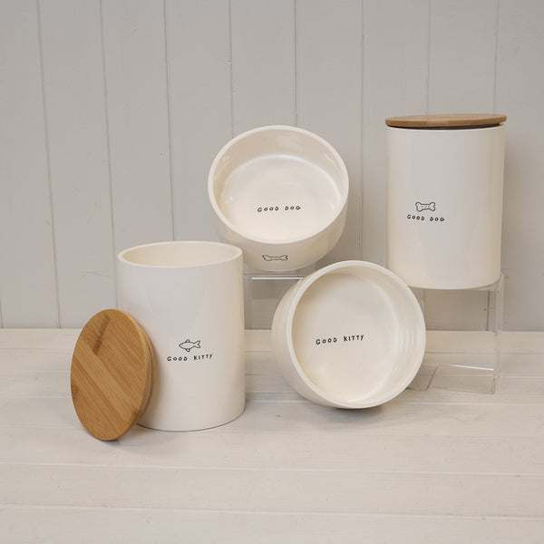 Dog Bone Ceramic Pet Bowl made of white ceramic with black bone and text design, paired with a wooden lid for storage.